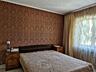 Семейный дом с детской площадкой и гаражом на тихой улице
