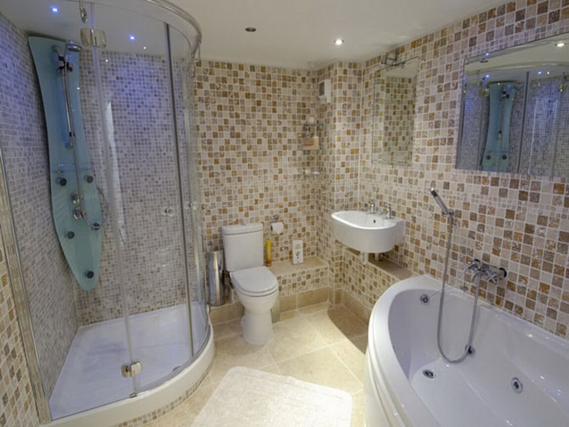 Отделка ванны плиткой. Интерьер ванной с угловой ванной. Ванная комната в зеленых тонах. Ванные комнаты псков. Интерьер ванной комнаты с угловой ванной.