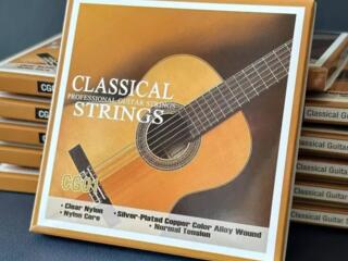 Гитарные струны и наклейки на гриф