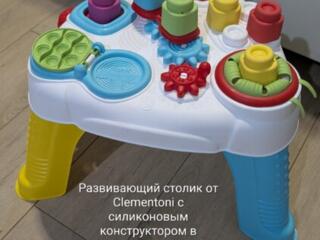 Продам развивающие фирменные игрушки, коляска, детская кухня