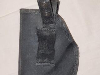 Кобура на пояс на кнопках.