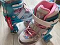 Регулируемые светящиеся роликовые коньки на 4-х колёсах. Новые.