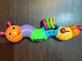 Игрушка: гусеница развивающая, погремушка.