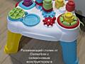 Продам развивающие фирменные игрушки, коляска, детская кухня